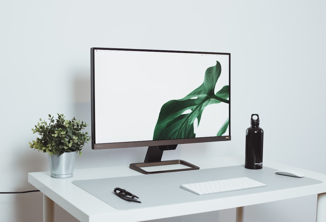 Minimalist monitor on a clean white desk